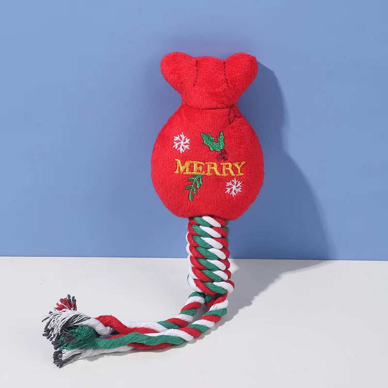 Red dog toy with 'Merry' text and a rope on a blue and white background