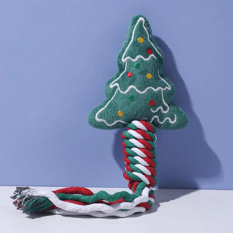 Christmas tree-shaped dog toy with rope on a purple background