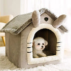 Small dog peeking out from a pet house shaped like a cartoon character with a fluffy interior.