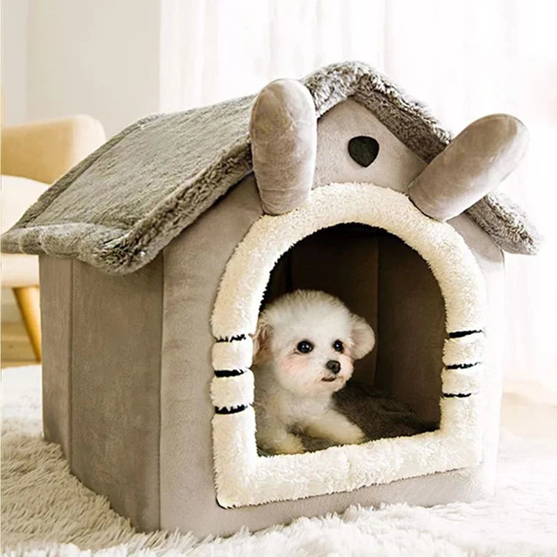 Small dog peeking out from a pet house shaped like a cartoon character with a fluffy interior.