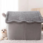 Gray pet bed with a fluffy top in a room setting