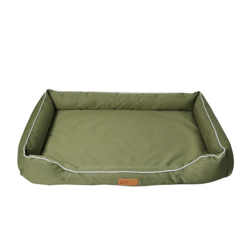 Green pet bed with white trim on a white background