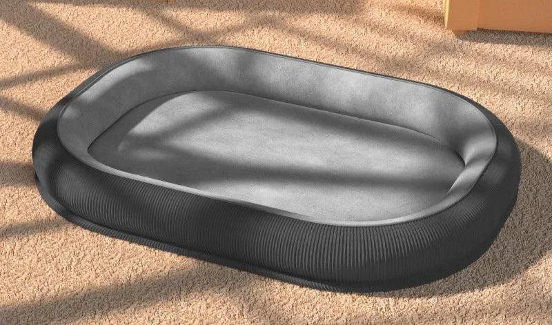 Black pet bed on a beige carpet