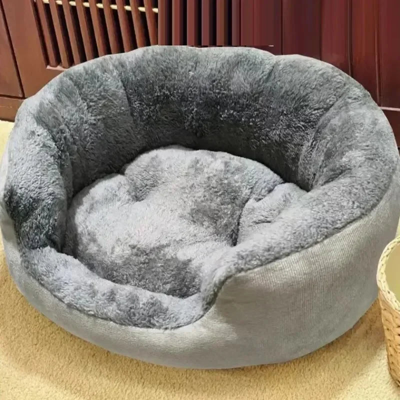 Gray pet bed on a yellow carpet with a wooden floor background