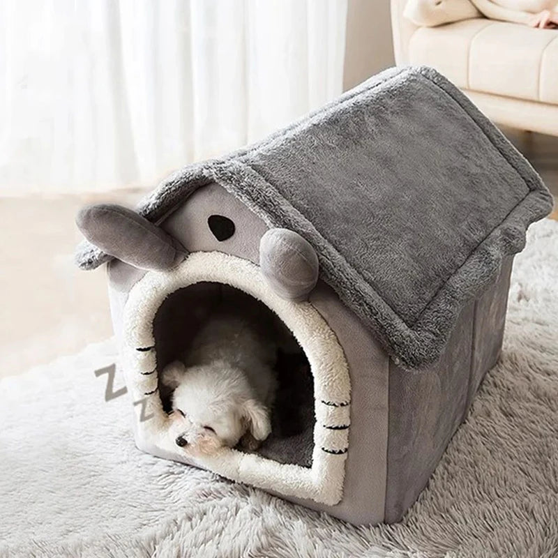 Pet house resembling a cartoon character with a small dog inside on a soft surface.