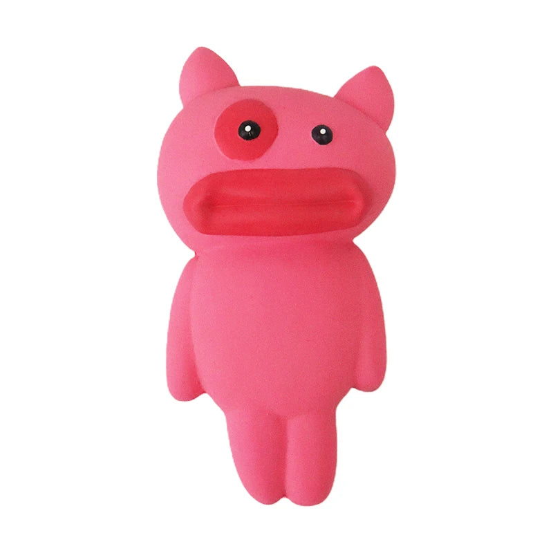 Pink cartoon-like dog toy creature with a surprised expression on a white background
