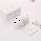 Dog-shaped USB powered light with packaging and cable on a light background