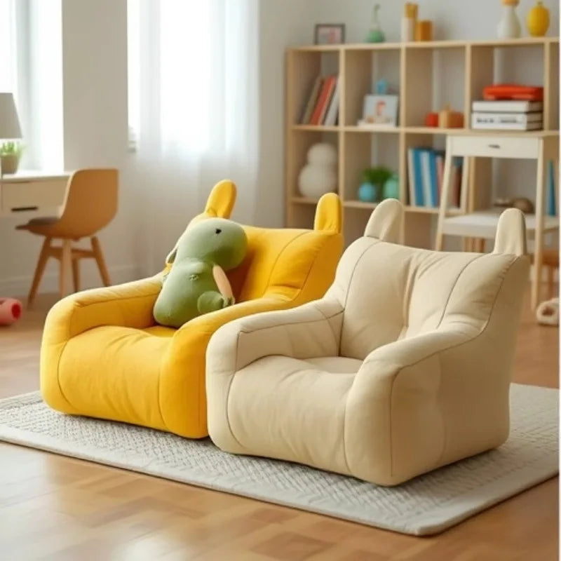 Two colourful dog sofabeds in a room with a bookshelf and desk.